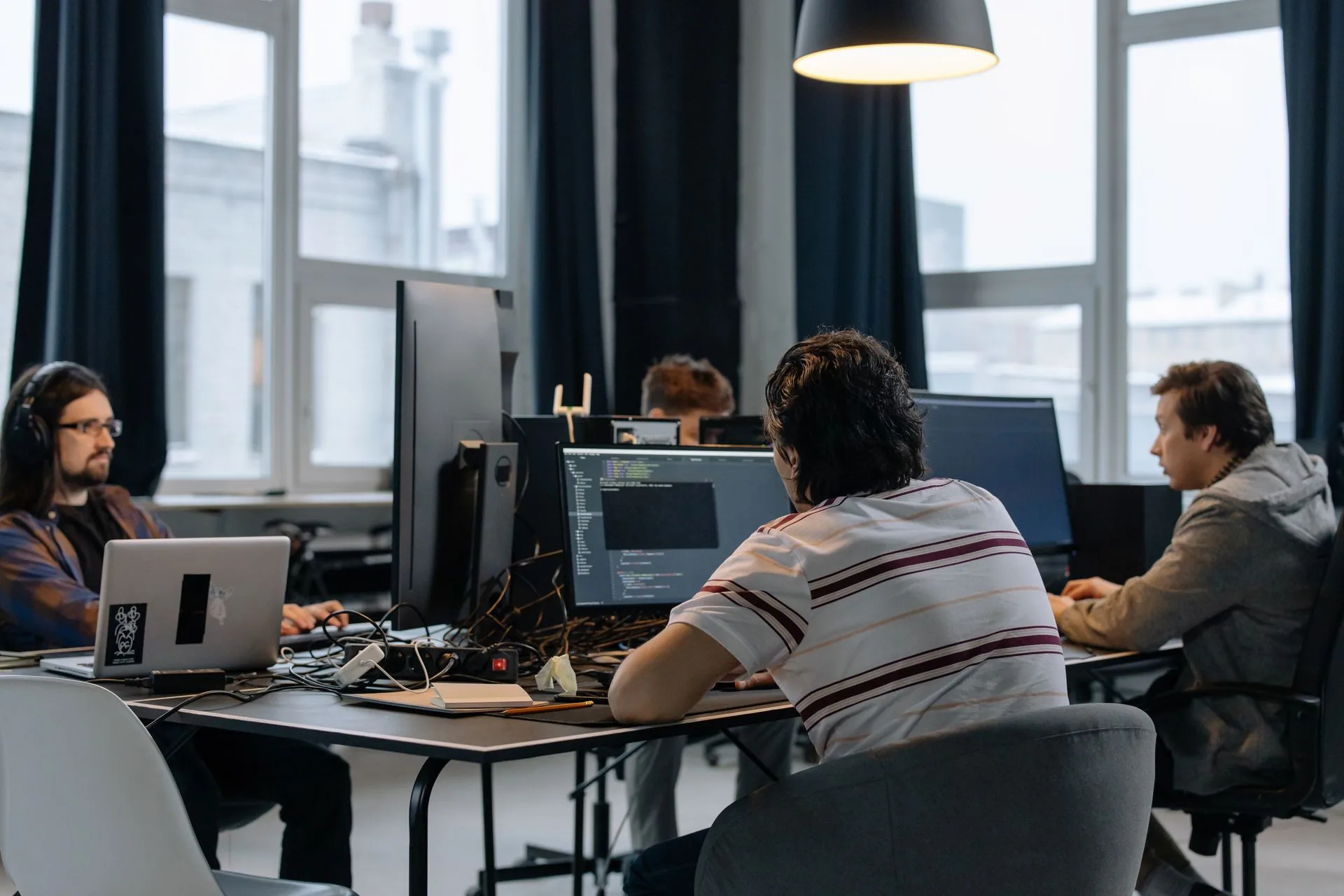 Software team at workstations during testing work